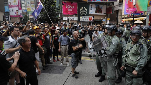 Protesters and the police in the streets of Hong Kong